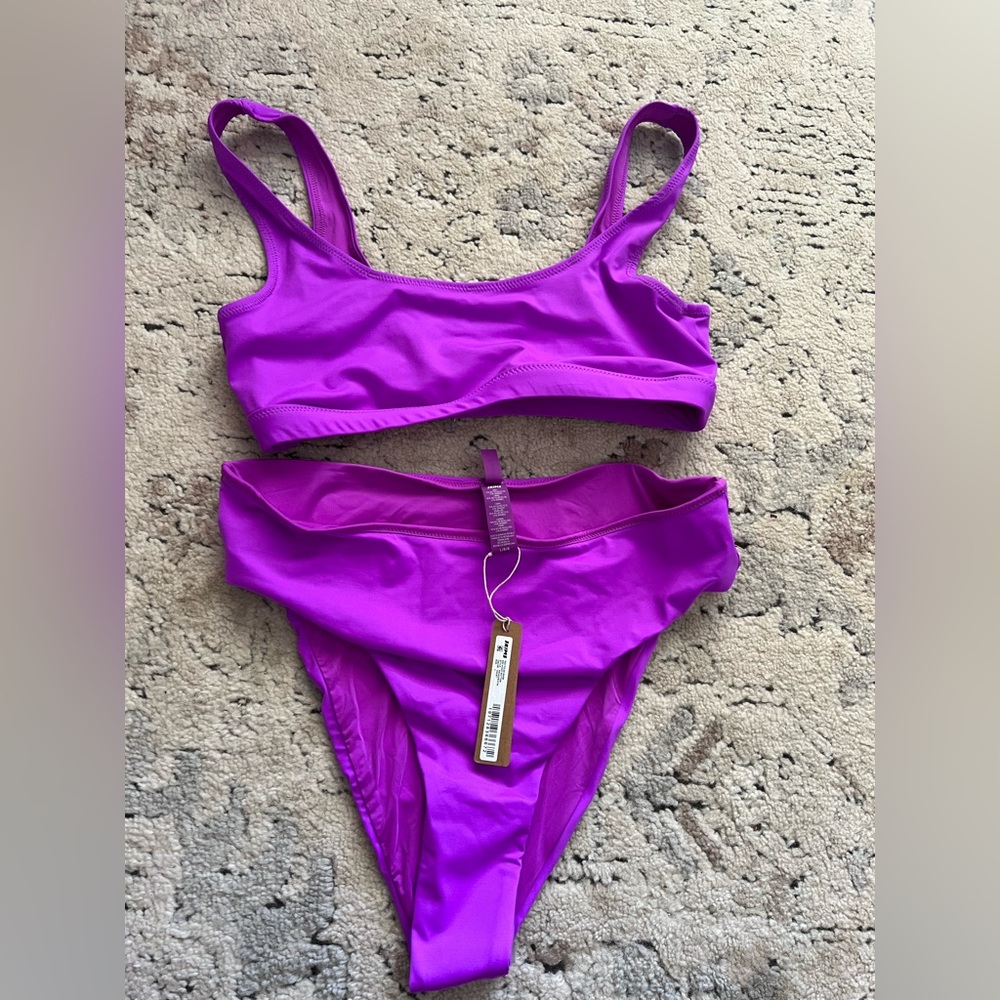 Skims swim set in violet.